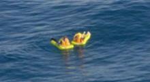 Image of survivors in the water after ultra-light aircraft engine failure