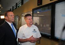 Image of RCC Australia Chief Lynn Walton providing the Prime Minister with an overview of the search operation