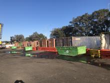 Thirteen containers in the waste yard