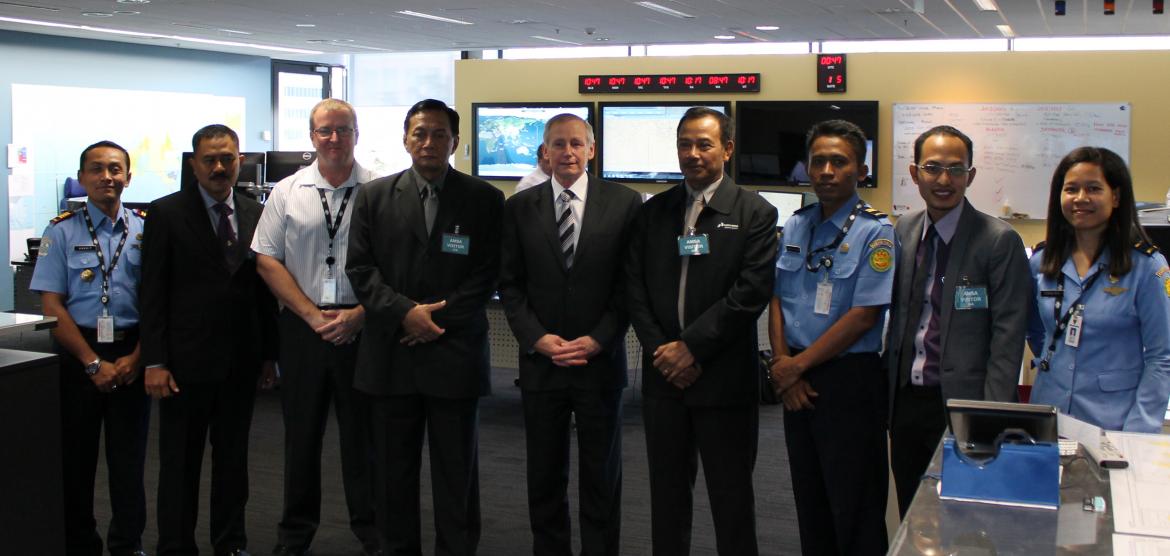 John Young, General Manager Emergency Response Division (centre); Alan Lloyd, Manager SAR Operations; and the BASARNAS delegation in AMSA's Rescue Coordination Centre
