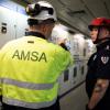 AMSA Officer pointing two FRNSW officers down a corridor