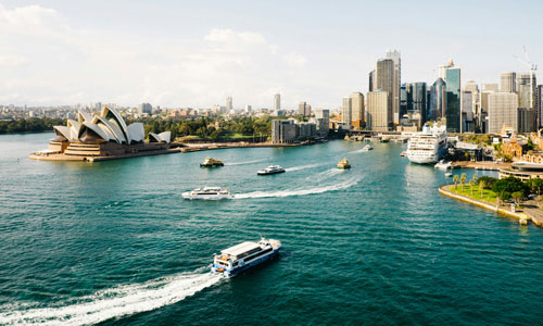 Ferries and cruise ship in Sydney Harbour with Sydney Opera House in background