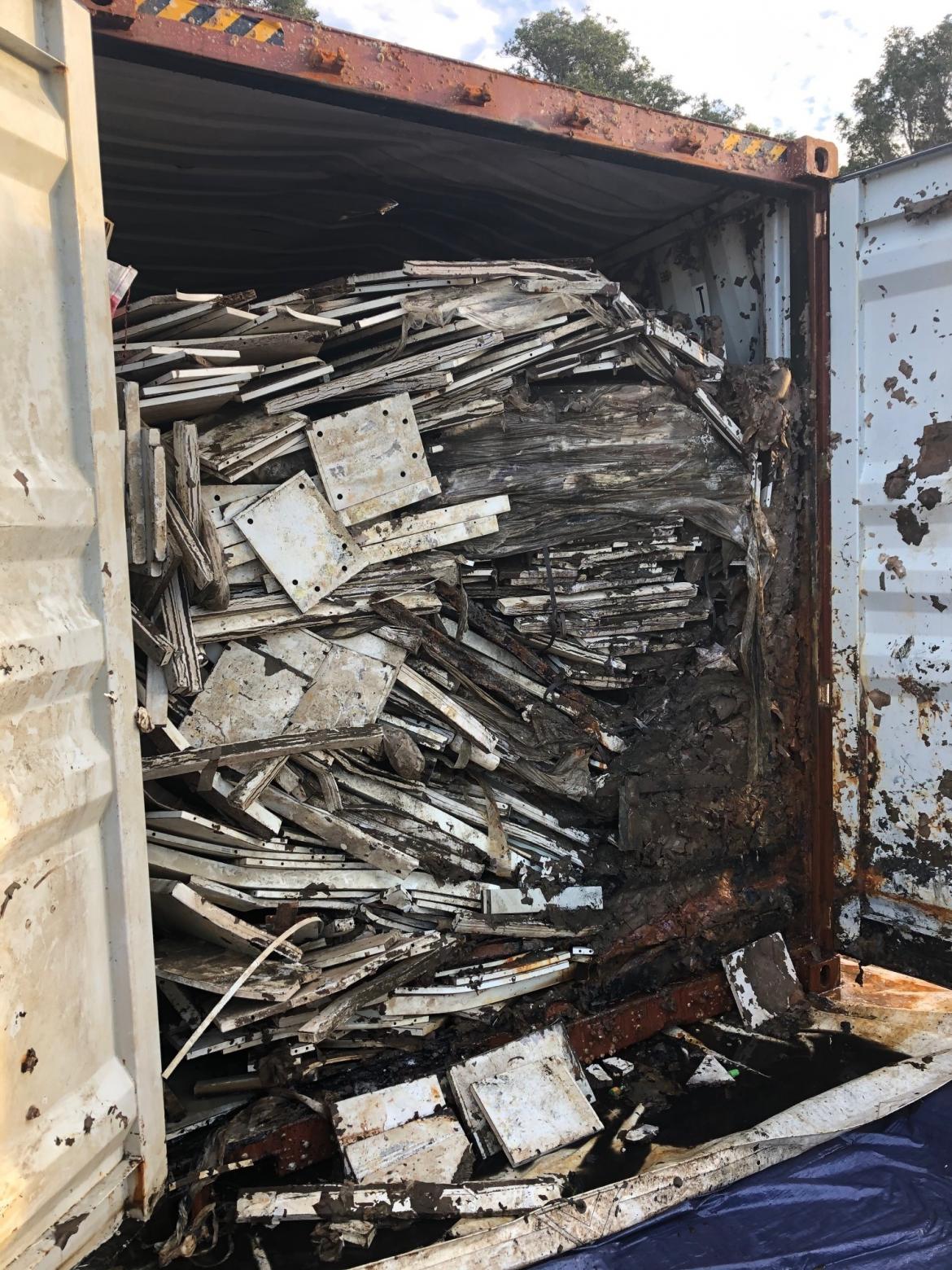 Container of furniture was unpacked for disposal.