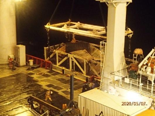 Crushed container delivered to shore