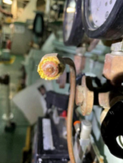 A photo of a blocked 15ppm bilge alarm sample line outlet with no flow