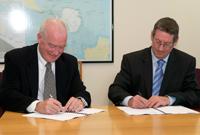 The Australian Maritime Safety Authority's previous Chief Executive Officer, Graham Peachey and the Australian Antarctic Division's Director, My Tony Press, signing the memorandum of understanding