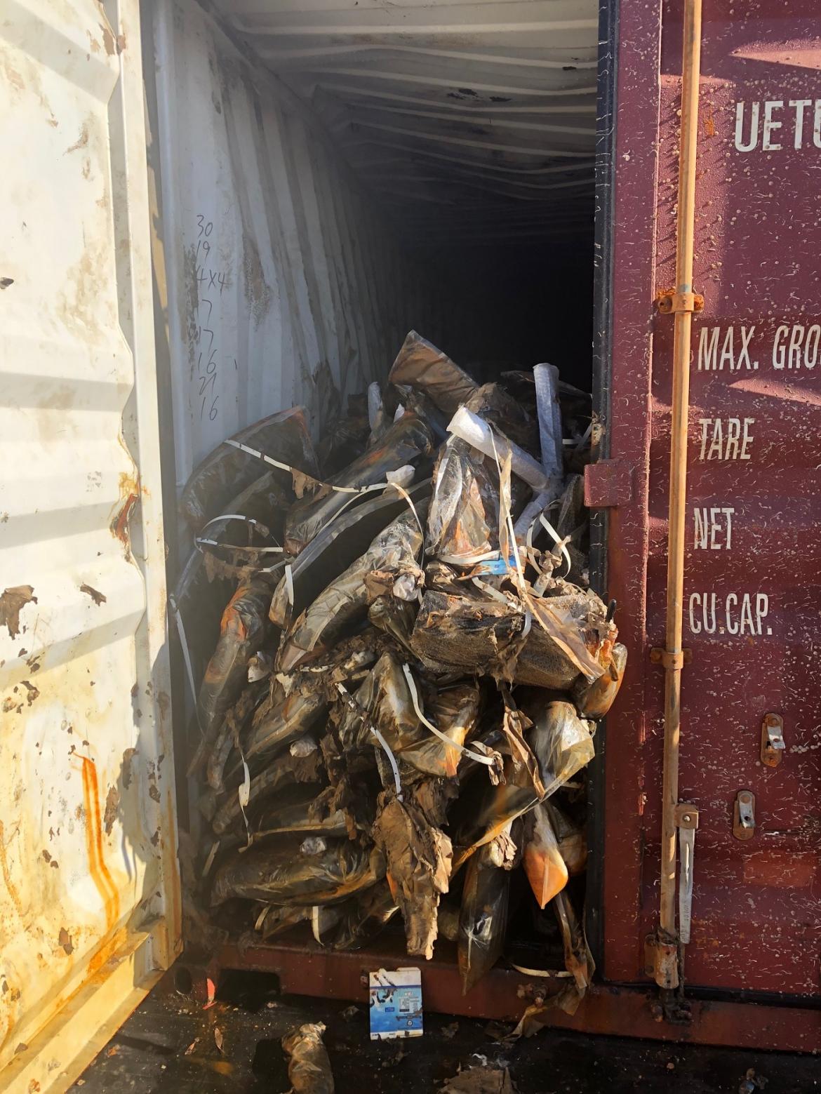 Office chairs have been unloaded and containers are ready for scrap metal processing