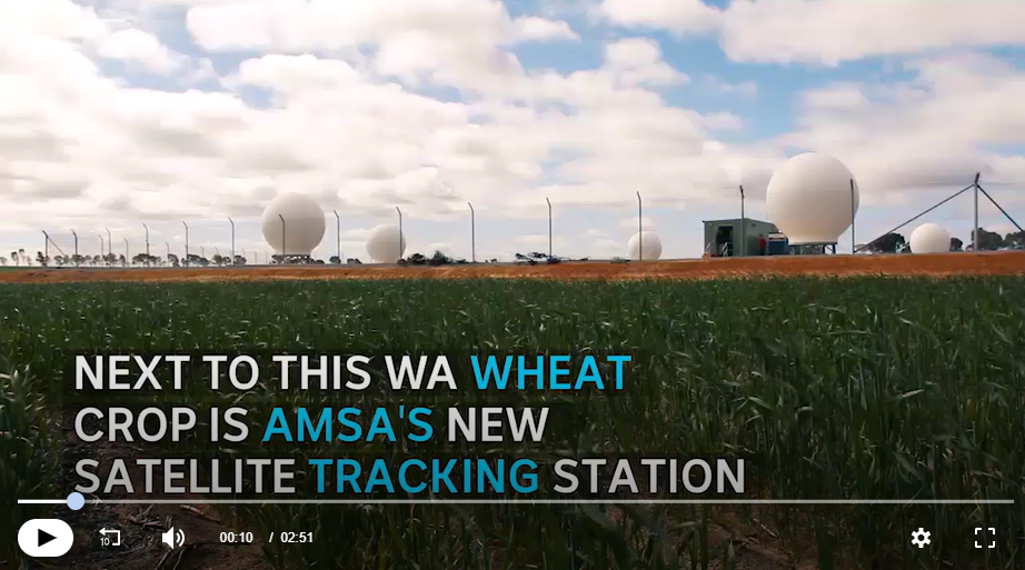 view over wheatfield to satellite receivers