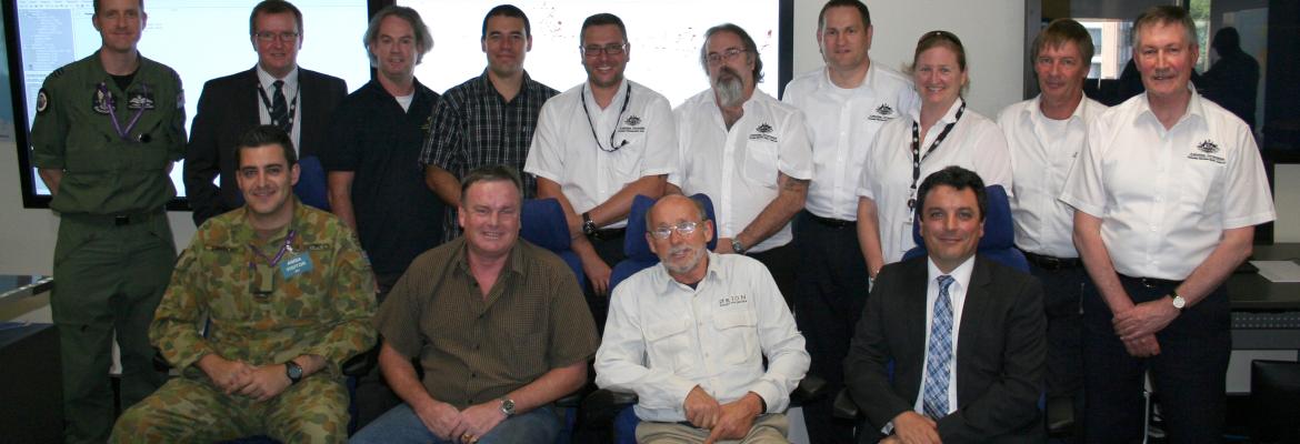 Rescued sailor Alain DeLord (front row, second from right) meets with AMSA search and rescue officers and Defence personnel who assisted in his rescue. Also present was David Steck, Deputy Consul, Embassy of France (front row, far right) Rescued sailor Alain DeLord (front row, second from right) meets with AMSA search and rescue officers and Defence personnel who assisted in his rescue. Also present was David Steck, Deputy Consul, Embassy of France (front row, far right)