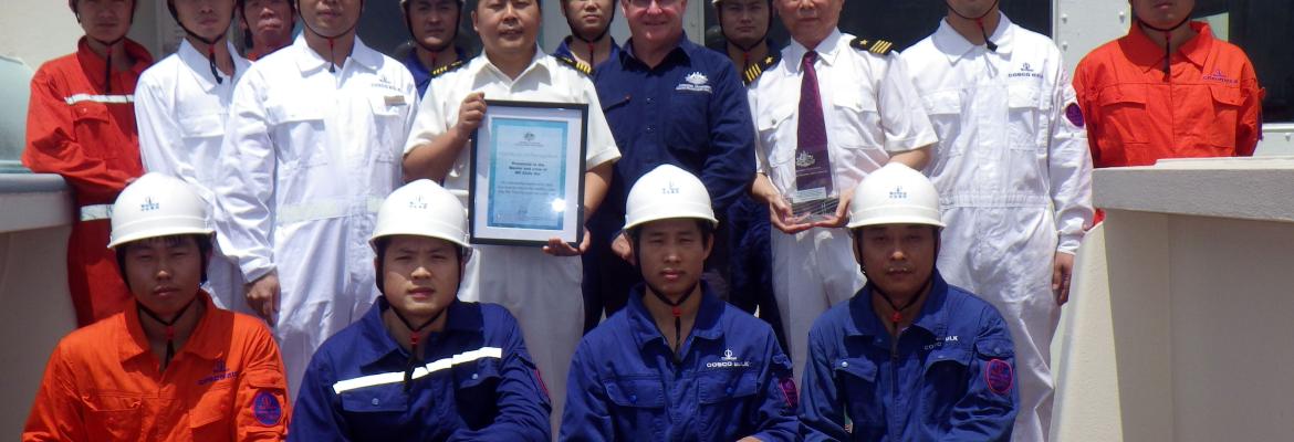 The Captain and crew of MV Xinfa Hai with AMSA Surveyor Greg Collinson, Newcastle