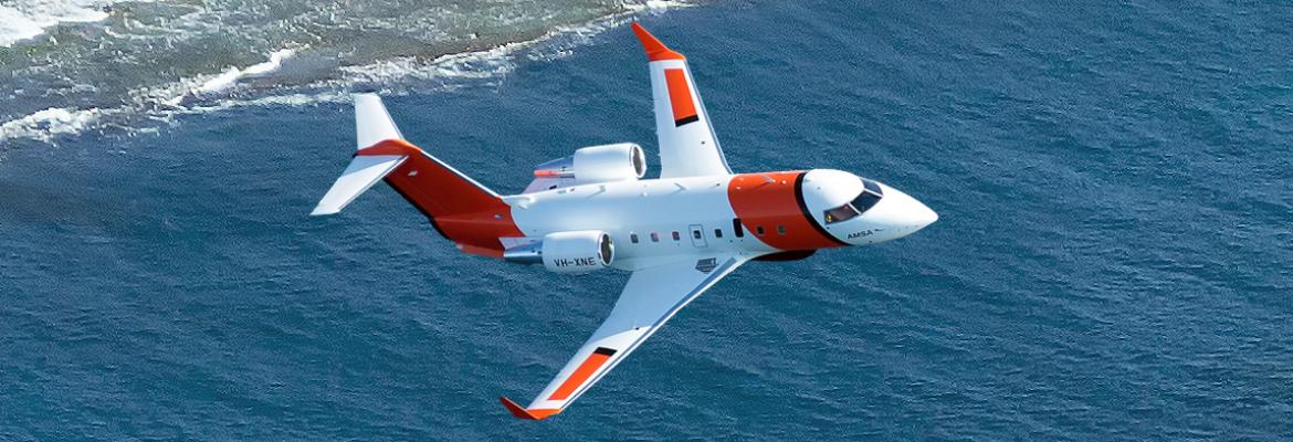 Photo of Challenger rescue aircraft flying over the ocean