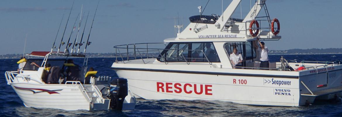 A rescue vessel assisting a smaller fishing boat