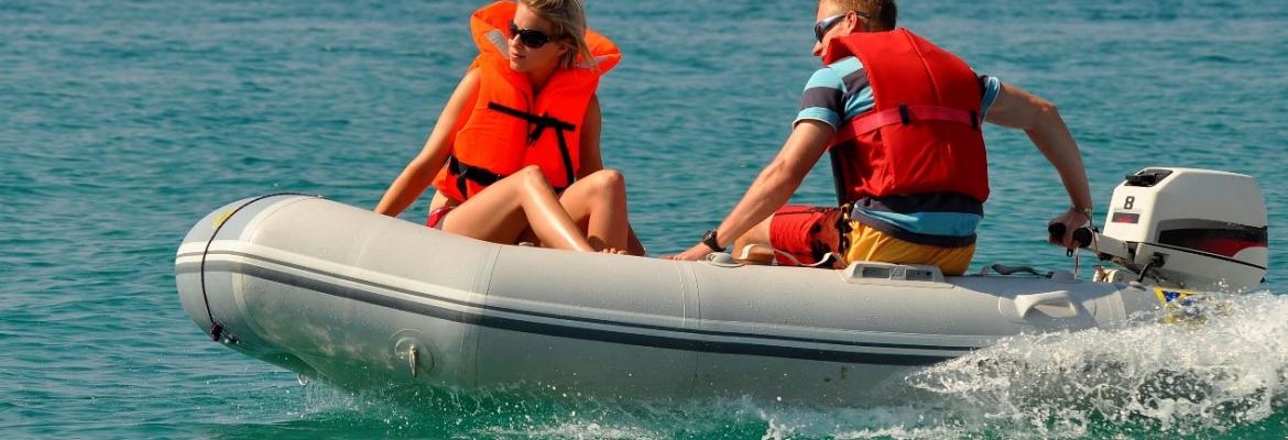 Two people wearing lifejacket on a boat