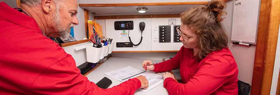 Image of colleagues working below deck