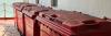 Large red recycling bins on board a vessel