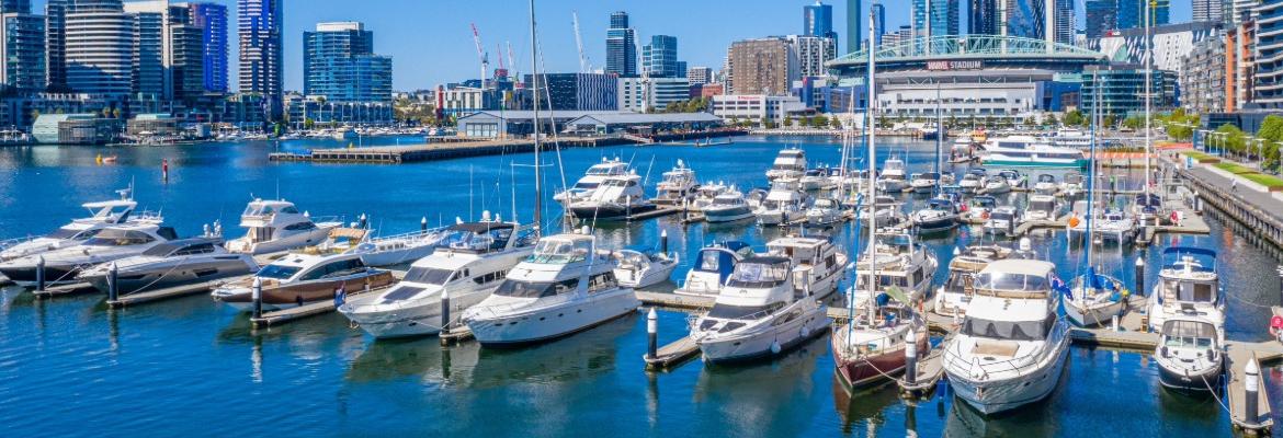 Boats anchored in a harbour in a big city